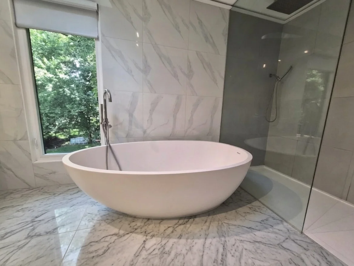Modern renovated bathroom in a New Jersey home with a walk in shower and vanity